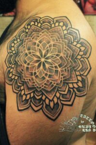 geometric tattoo on shoulder cap area